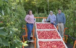 From left, Kristen, Alison and Tom DeMarree during September harvest.