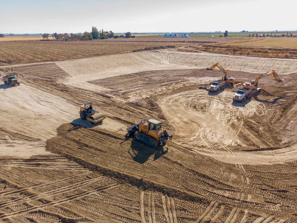 Construction of a 9 million gallon pond at a new Washington Fruit orchard in the Columbia Basin