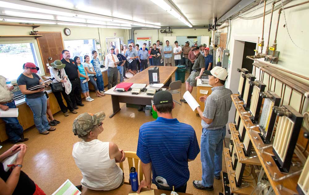 Oregon State University researcher, Yan Wang, right, talks about the Mid-Columbia Research and Extension Center laboratory on August 8, 2013, in Hood River, Oregon. <b>(TJ Mullinax/Good Fruit Grower)</a>
