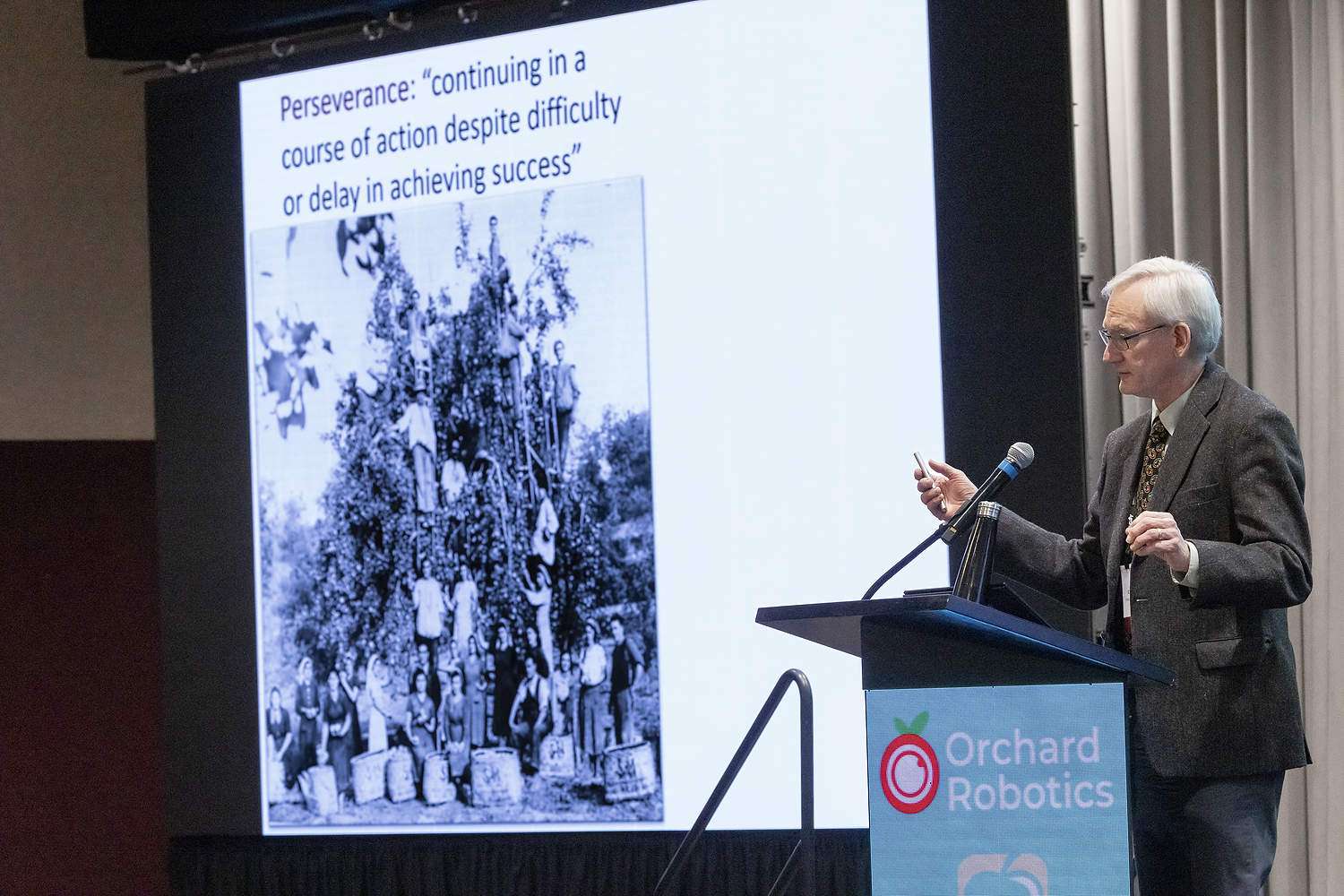 Greg Lang, professor emeritus of Michigan State University, discusses the changing horticultural strategies of tree fruit during his Batjer Address at the Washington State Tree Fruit Association’s annual meeting in December in Wenatchee, Washington. (TJ Mullinax/Good Fruit Grower)