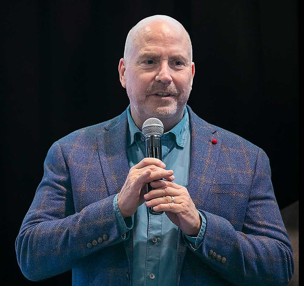 Taylor accepts the Silver Pear Award during the Washington State Tree Fruit Association Annual Meeting banquet in December while sharing his optimism that the category is on the precipice of a new era of opportunity. (TJ Mullinax/Good Fruit Grower)