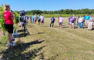 Sue-Ann Staff, left, talks grape growing and winemaking on July 22 during the International Fruit Tree Association’s summer tour in Ontario, Canada. (Matt Milkovich/Good Fruit Grower)