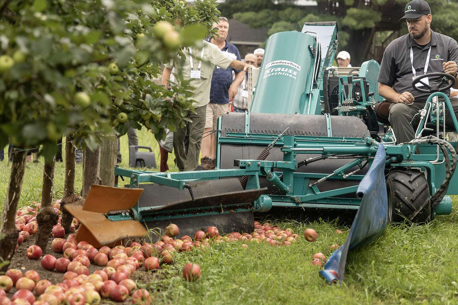 A Krauss SF Harvester from ProduceTech sweeps apples on the ground at the Angry Orchard Cider House in Walden, New York