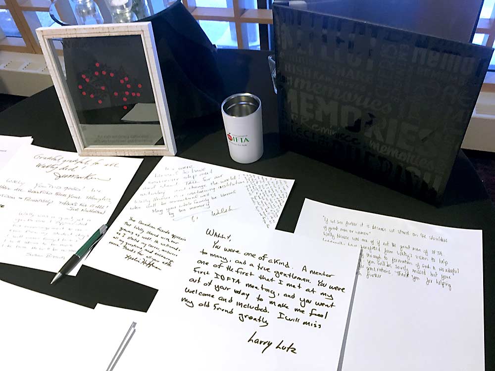 Messages to the late Wallace Heuser cover a memorial table to the founder and former president of the group that would later become the International Fruit Tree Association, or IFTA. Heuser died at the age of 90 Feb. 5 in Lawrence, Michigan. (Ross Courtney/Good Fruit Grower)
