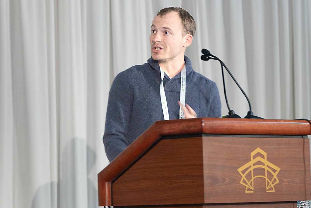 Michigan State University research assistant Chayce Griffith discusses bitter pit prevention during the International Fruit Tree Association’s annual conference on Feb. 19 in Rochester, New York. (Matt Milkovich/Good Fruit Grower)