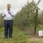 Cornell University tree fruit physiologist Terence Robinson speaking in a New York orchard