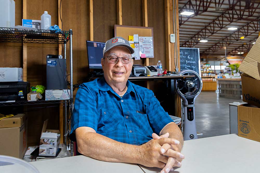 Mitch Lynd at his family’s farm market in Pataskala, Ohio, in July. Lynd co-founded the Midwest Apple Improvement Association, a grower group that has bred and released eight apple varieties, including MAIA-1 (marketed as EverCrisp). (Matt Milkovich/Good Fruit Grower)