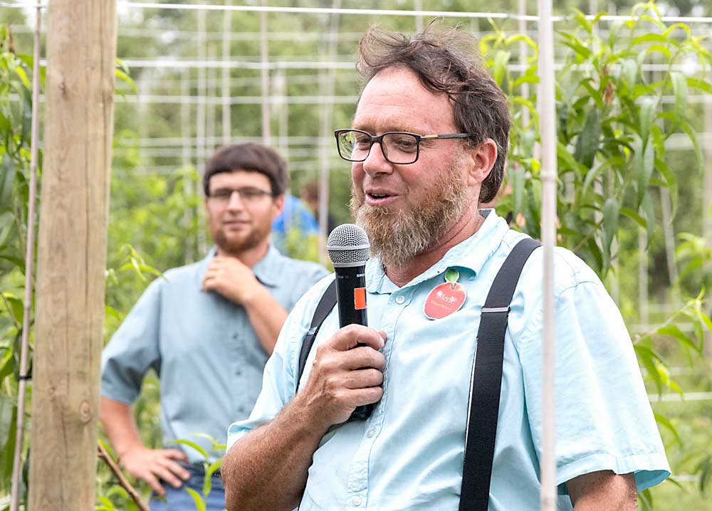 Grower Merle Hershberger hosted the Ohio Produce Growers and Marketers Association summer field day at Hillcrest Orchard in July, where he discussed planar peaches and other topics. (Matt Milkovich/Good Fruit Grower)