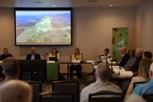 The new USA Pears logo is just the first step in a new approach to pear marketing, targeting younger consumers, that was presented by President CarrieAnn Arias, third from left, during the Pear Bureau Northwest annual meeting on May 19 and 20 in Wenatchee, Washington. (Kate Prengaman/Good Fruit Grower)
