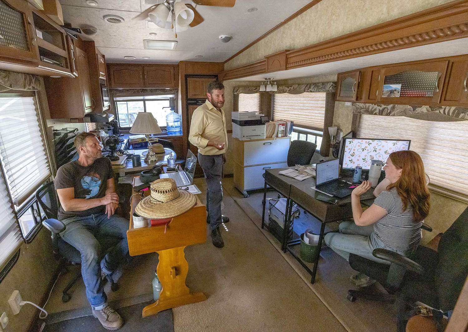 Left to right: Corey Brown, Josh Brown and Bernadette Cowe talking in Similkameen Nurseries’ mobile office