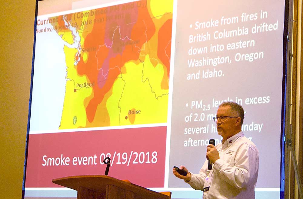 Washington State University Assistant Professor Tom Collins shows a heat map of particulate matter and oxygen readings on August 19, 2018, when forest fires in British Columbia, Canada, blanketed the Pacific Northwest with smoke. Collins spoke about this smoke event during the 2018 Washington Grape Society meetings in Grandview, Washington on November, 15, 2018. (Kate Prengaman/Good Fruit Grower)