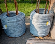 Steel materials for trellis construction await use at a new tree fruit block in Royal City, Washington, in August. (TJ Mullinax/Good Fruit Grower)