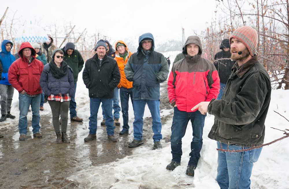 Jake Robison talks about succession planning and transitioning to new varieties during the International Fruit Tree Association tour at his family’s Chelan, Washington, orchards in February. <b>(TJ Mullinax/Good Fruit Grower)</b>