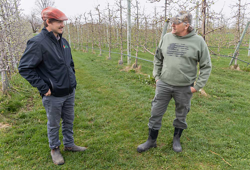 Kyle Rasch, left, and his father, Tom Rasch, were gradually transitioning apple blocks to organic until 2023, when they decided to transition the entire farm. They see a more profitable future in the organic apple market. (Matt Milkovich/Good Fruit Grower)