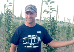 Michael Zingler stands among the trees at Zingler Farms Inc. in western New York. He is one of several growers who is planting the new variety Smitten. <b>(Courtesy James Zingler)</b>