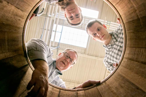 Air Force veteran Nick French, right, learns how to open and inspect a wine barrel Wednesday, Oct. 18, 2017, at the Washington State University Tri-Cities campus Wine Science Center in Richland. Veterans such as French are entering vineyard and enology courses at a higher rate than other disciplines at WSU. Teaching the course is assistant professor Tom Collins and watching is his research assistant Rosemary Veghte. (Ross Courtney/Good Fruit Grower)