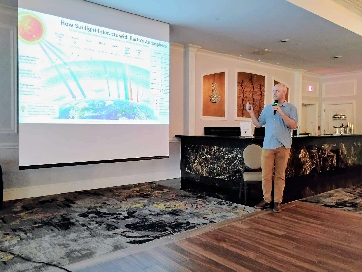 Cornell University plant pathologist Scott Cosseboom stands in front of a presentation.