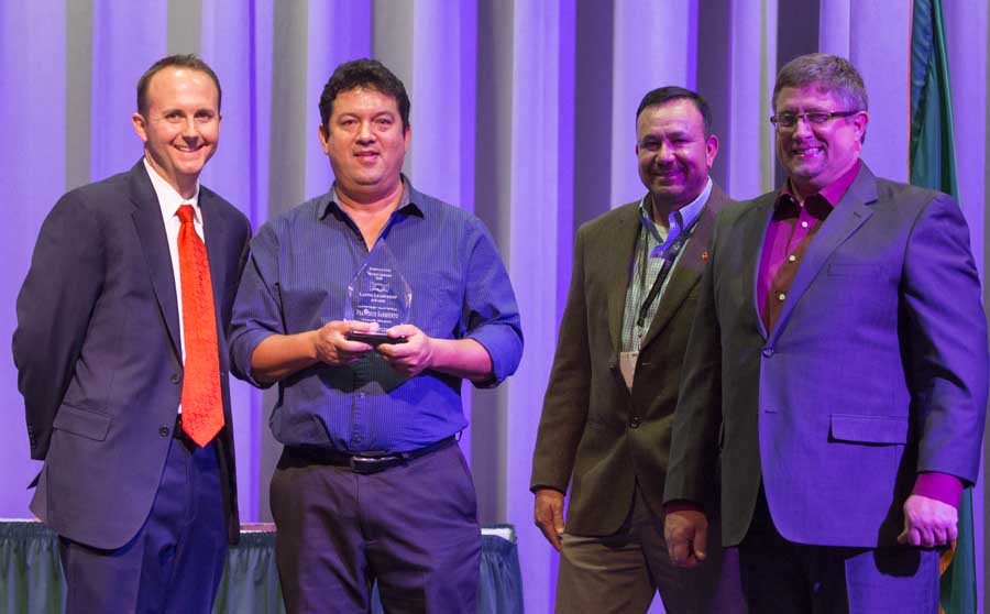 Francisco Sarmiento is presented with Latino Leadership Award during the 112th Annual Meeting and Northwest Hort Expo banquet on December 6, 2016 in Wenatchee, Washington. From left, West Mathison, Sarmiento, José Ramirez and Sam Godwin. <b>(TJ Mullinax/Good Fruit Grower)</b>