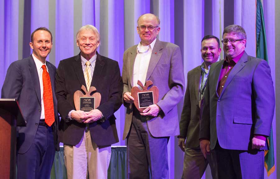 Charlie Pomianek and Kirk Mayer is presented with Distinguished Service Awards during the 112th Annual Meeting and Northwest Hort Expo banquet on December 6, 2016 in Wenatchee, Washington. From left, West Mathisson, Pomianek, Mayer, José Ramirez and Sam Godwin. <b>(TJ Mullinax/Good Fruit Grower)</b>