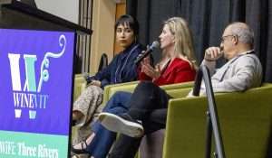 Liz Thach of Wine Market Council, center, answers questions about consumer preferences and beliefs at the Washington Winegrowers Association’s 2026 WineVit conference on Feb. 10 at the Three Rivers Convention Center in Kennewick, Washington. Melissa Clubb of L’Ecole No. 41, left, and Danny Brager of 3 Tier Beverages, wait their turn to speak. (TJ Mullinax/Good Fruit Grower)