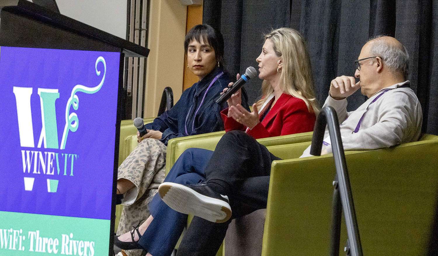 Liz Thach of Wine Market Council, center, answers questions about consumer preferences and beliefs at the Washington Winegrowers Association’s 2026 WineVit conference on Feb. 10 at the Three Rivers Convention Center in Kennewick, Washington. Melissa Clubb of L’Ecole No. 41, left, and Danny Brager of 3 Tier Beverages, wait their turn to speak. (TJ Mullinax/Good Fruit Grower)