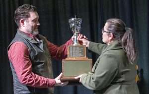 Ryan Flanagan, left, accepts the Washington wine industry’s Erick Hanson Memorial Grower of the Year Award at the Washington Wine Industry Foundation’s Party + Auction event on Feb. 10 at the Three Rivers Convention Center in Kennewick. (TJ Mullinax/Good Fruit Grower)