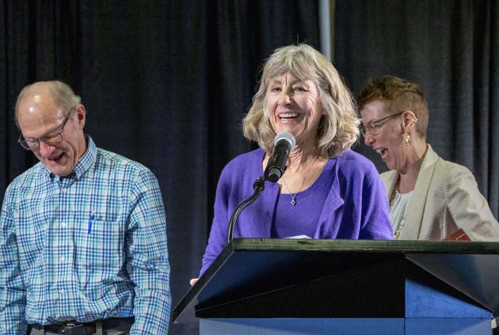 Melissa Hansen, center, is honored with an Industry Service Award for her years spent leading the research program for the Washington State Wine Commission. (TJ Mullinax/Good Fruit Grower)