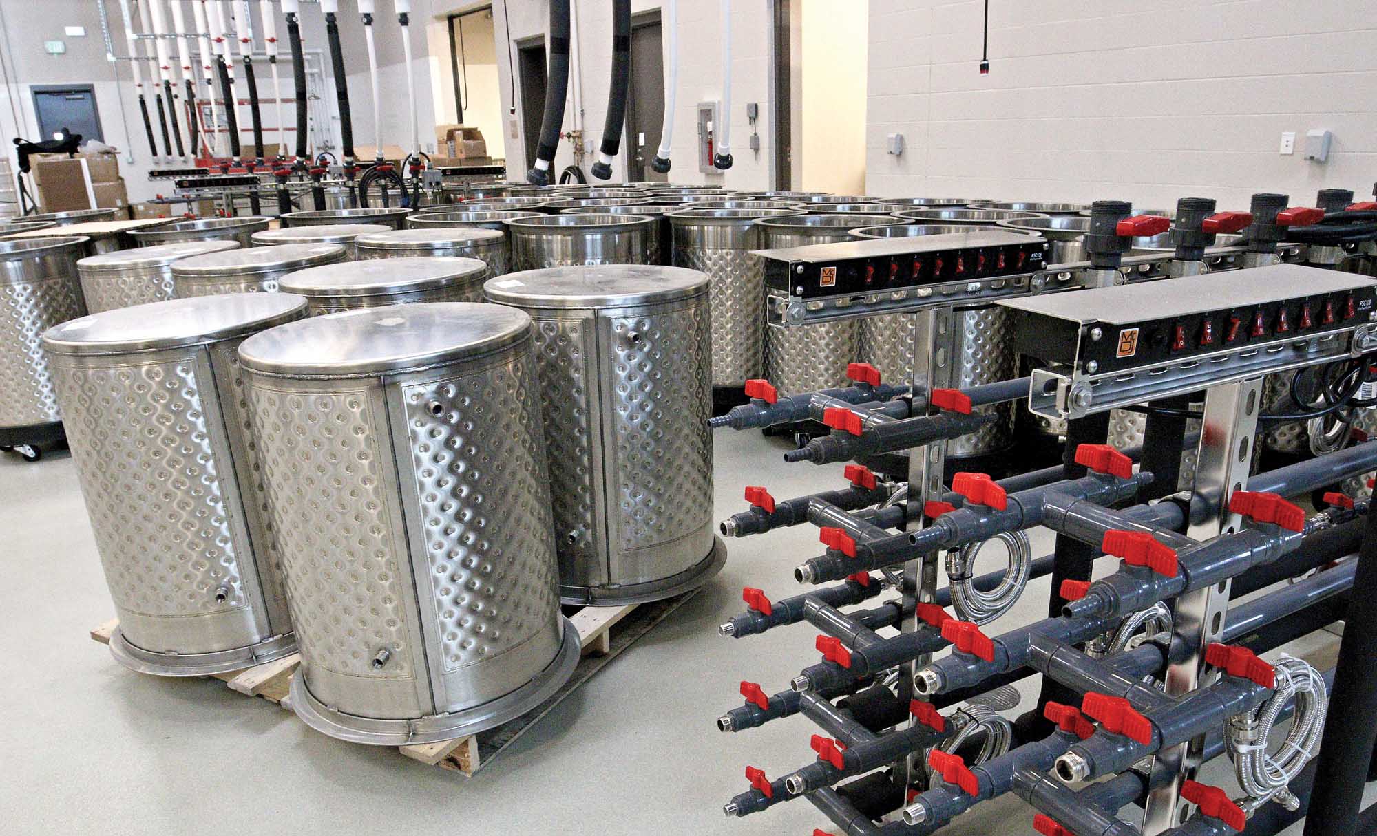 Some of the 192 climate-controlled, stainless steel research fermenters before they are assembled at the Washington State University Wine Science Center in Richland, Washington on May 4, 2015. (TJ Mullinax/Good Fruit Grower)