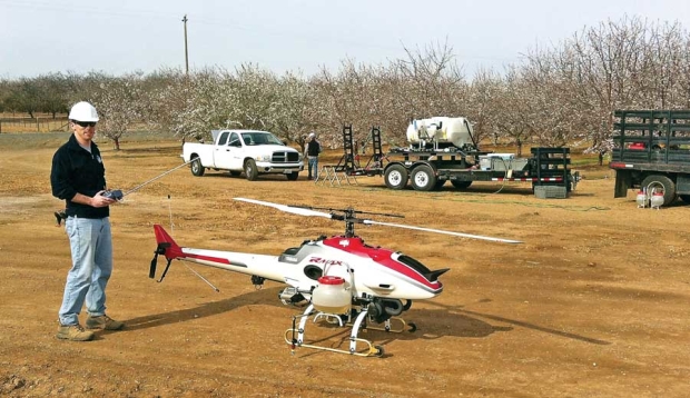 The RMAX unmanned helicopter must be operated within line of sight of the pilot, who uses a remote control using a 72 MHz transmitter. <b>(Courtesy Yamaha)</b>